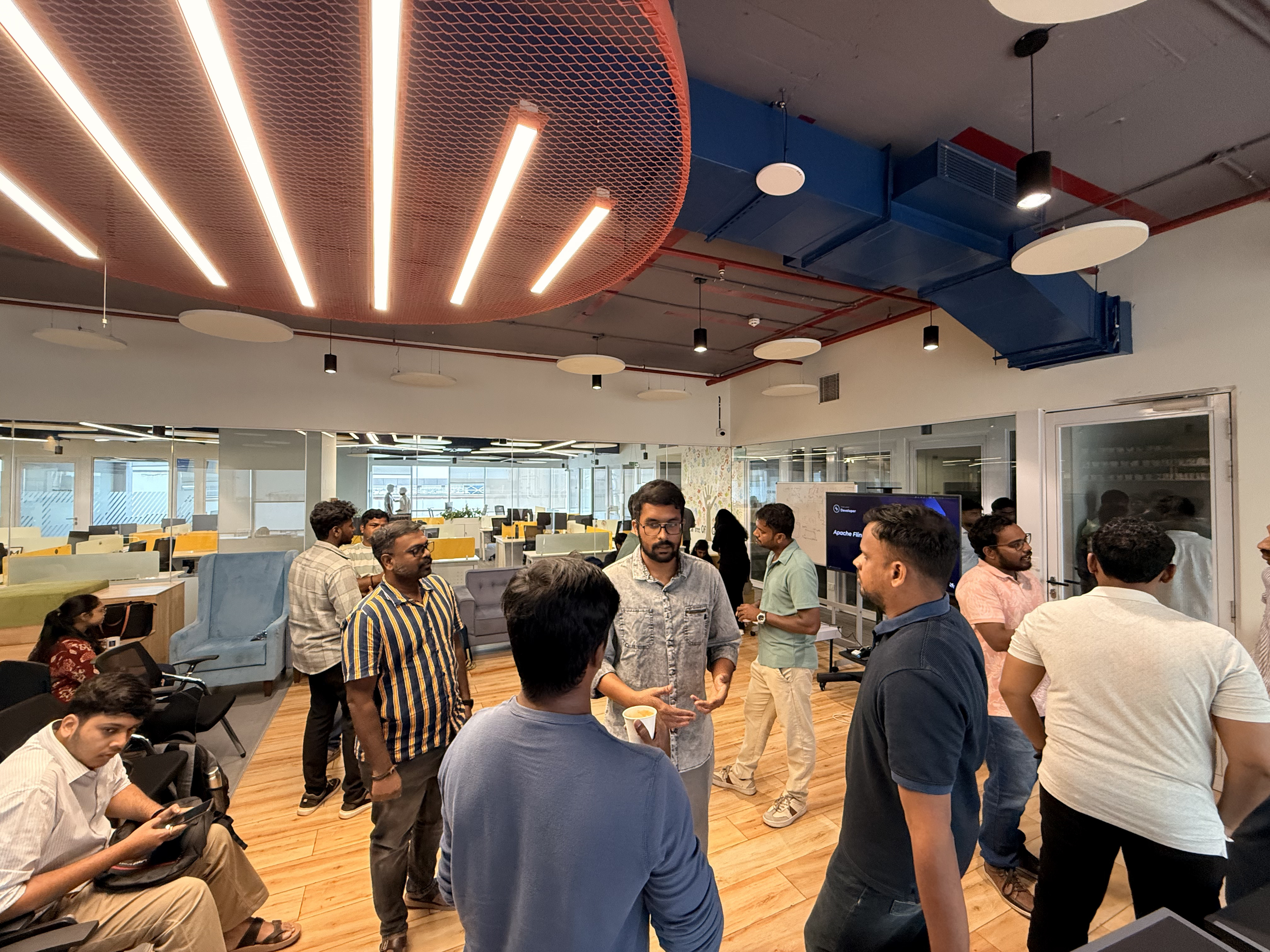 Attendees standing and talking during a break between sessions at the Apache Kafka Chennai meetup