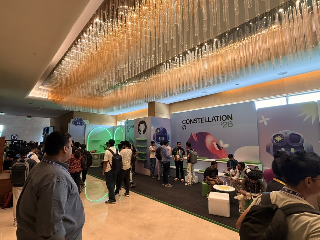 Constellation '26 foyer with branded booths and Octocat