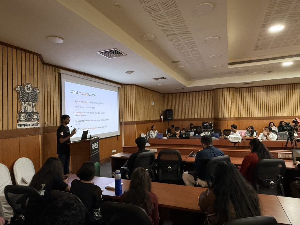 Ganesh Patil presenting a slide titled What this talk is about during his talk on documenting Bruno
